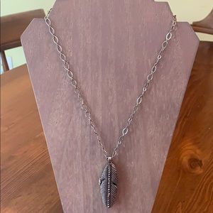 Lucky Brand brass tone feather locket